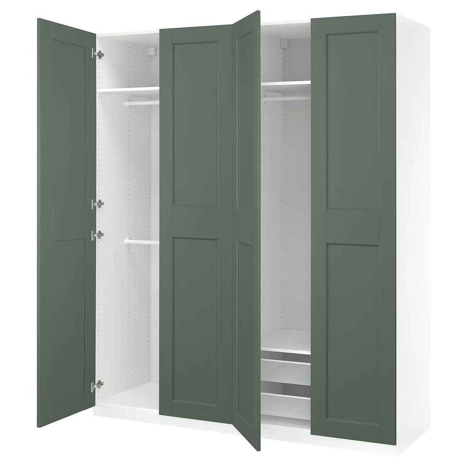 A green IKEA PAX wardrobe with open doors, revealing shelves and a clothes rail inside.