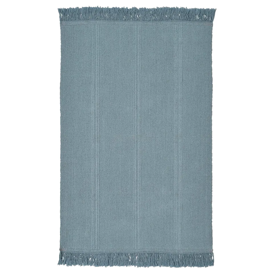 SORTSÖ blue cotton rug, rectangular with fringe edges.