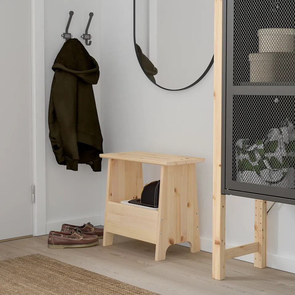 PERJOHAN wooden stool with storage. Lightwood and rectangular design. Hangs jackets, stores items.