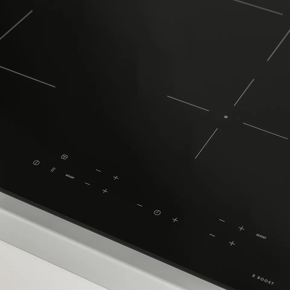 Black induction cooktop with touch controls, two boost zones, and sleek design.