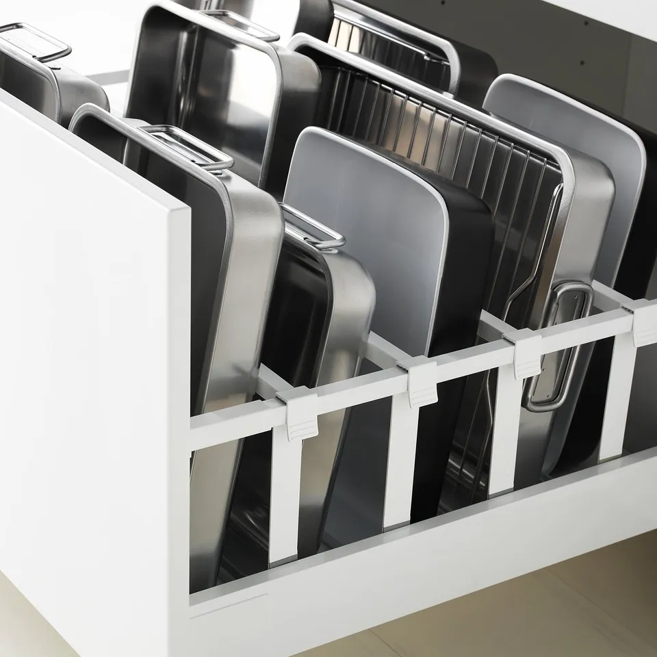 Kitchen drawer with multiple slots for organising baking trays vertically, ensuring easy access and space efficiency.