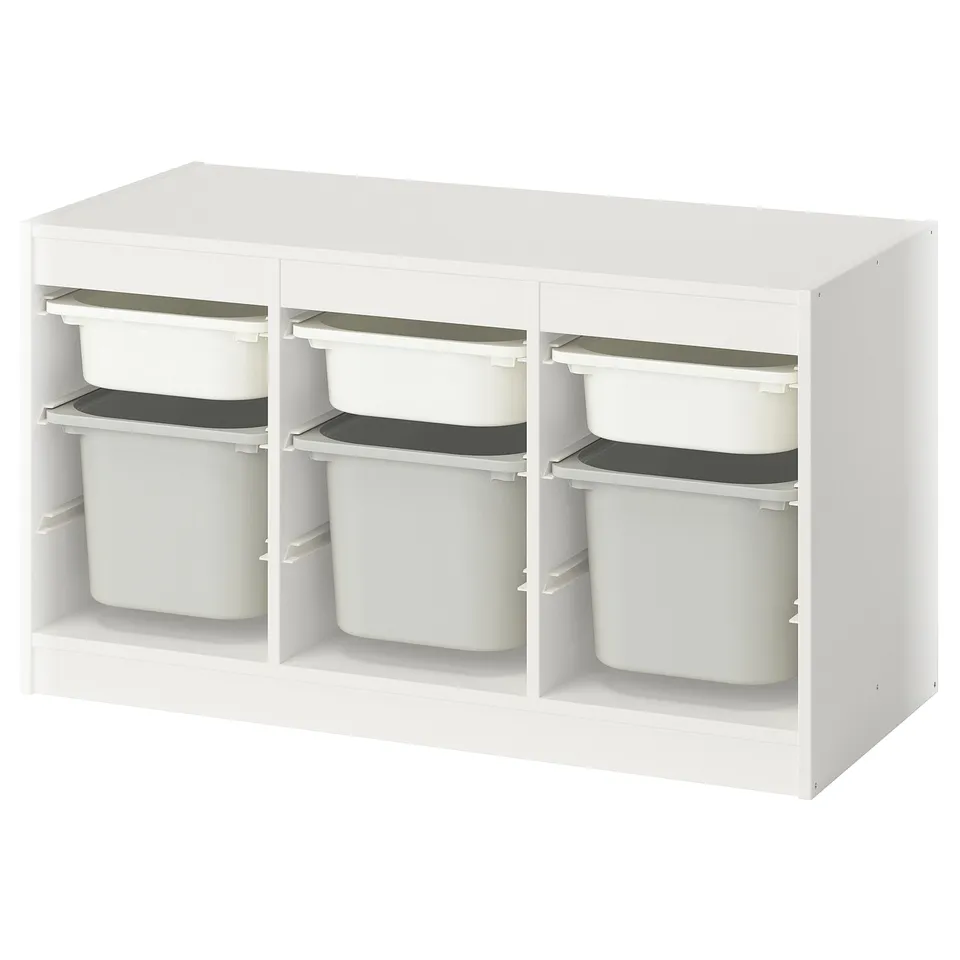 White TROFAST storage unit with 6 removable bins for kids toys.