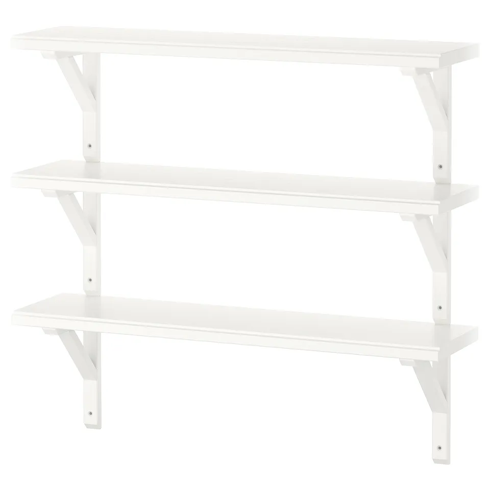 Three-tier, white wall shelf made of solid wood with smooth and bevelled edges. Ideal for storage and display; simple, practical design.