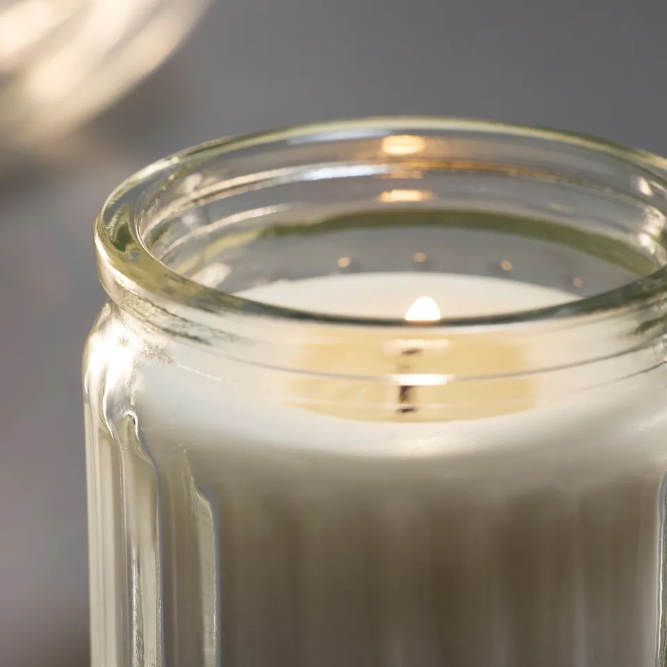 HÖKGÖK Scented candle in glass, Vanilla pale beige, 12 hr