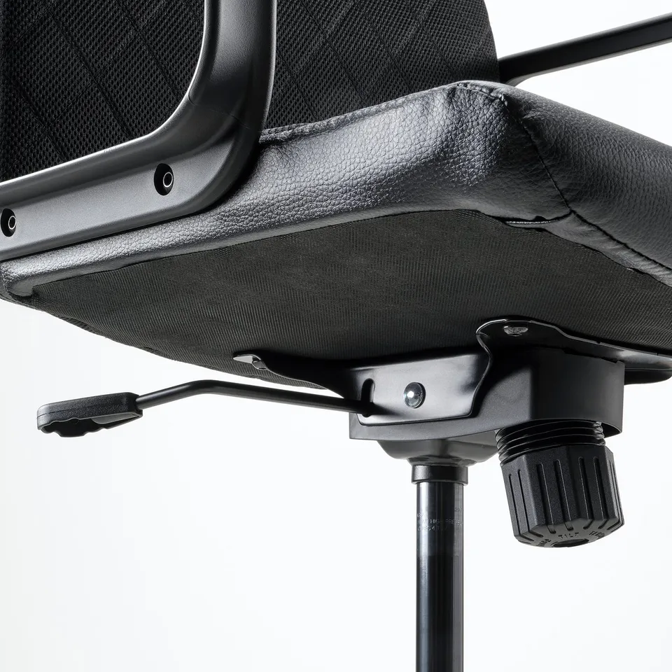 Black office chair base with adjustable height and tilt, featuring durable coated fabric and safety castors.