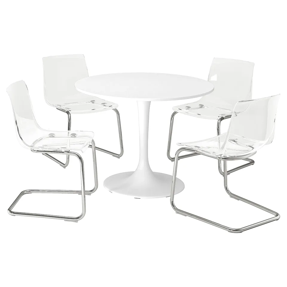 A white DOCKSTA dining set with a round table and four clear plastic chairs.