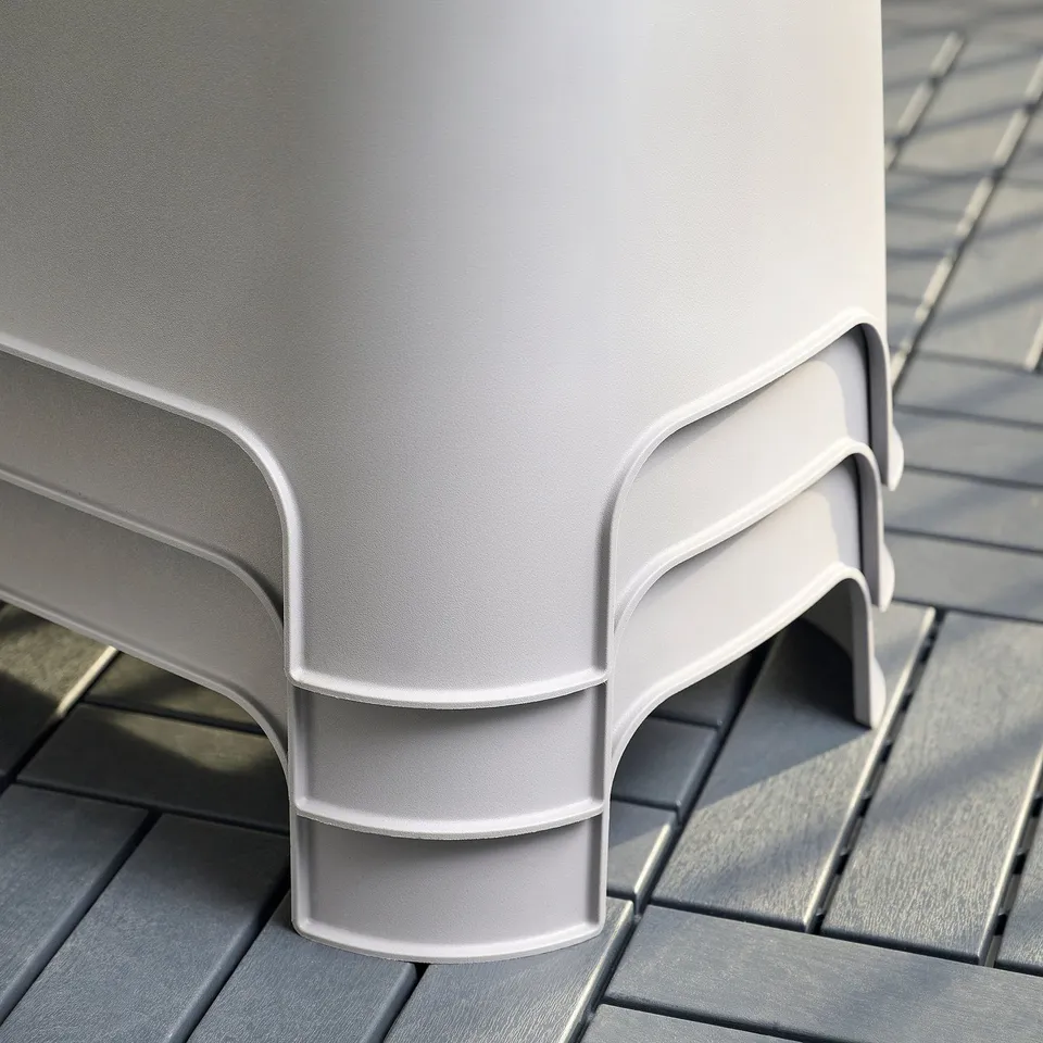 White stackable square planter with curved edges, made from recycled plastic. Suitable for patio or balcony.