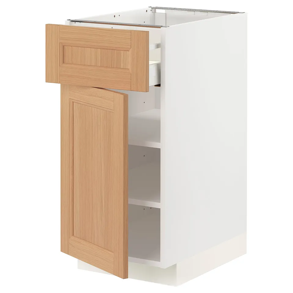 A white METOD kitchen cabinet with an oak drawer and door, featuring a modern minimalist design.