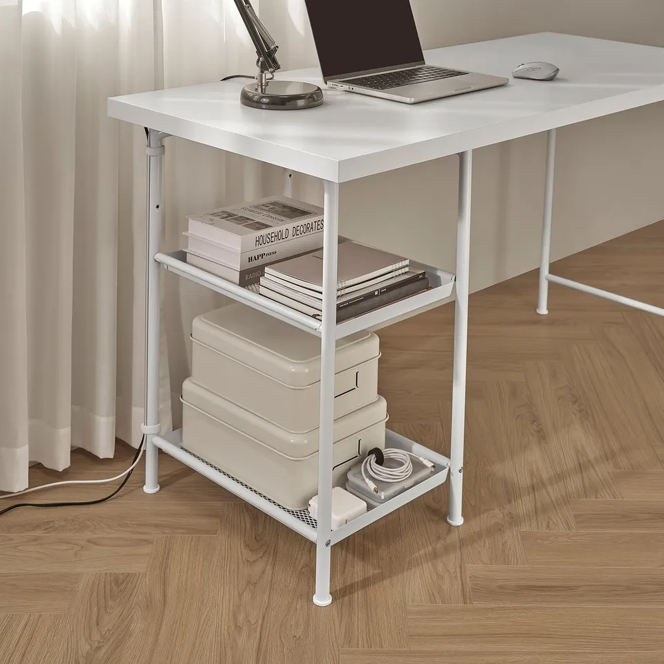 Desk with shelves and cable management, laptop, mouse, lamp, books, files, storage boxes.