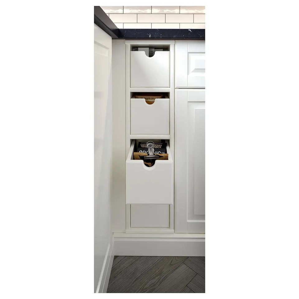 White kitchen storage box. Rectangular, felt-bottomed, for small items.