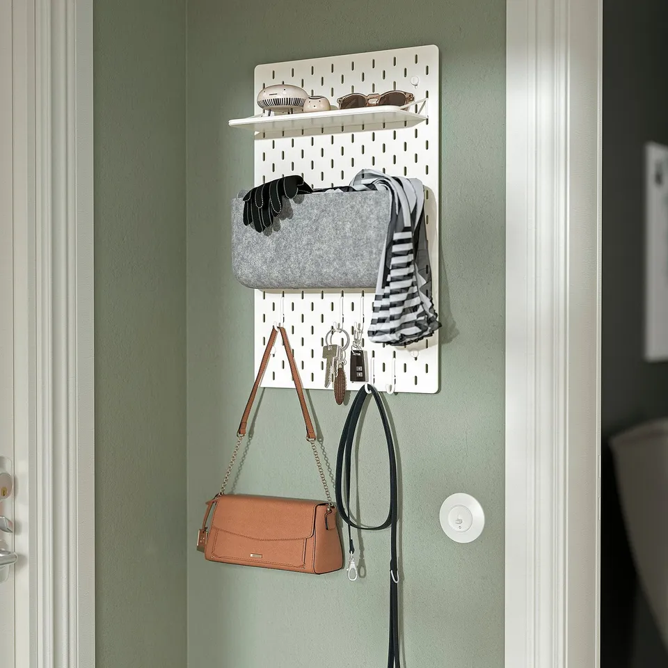 SKÅDIS pegboard organises accessories, like bags, gloves, and keys, keeping them visible and accessible.