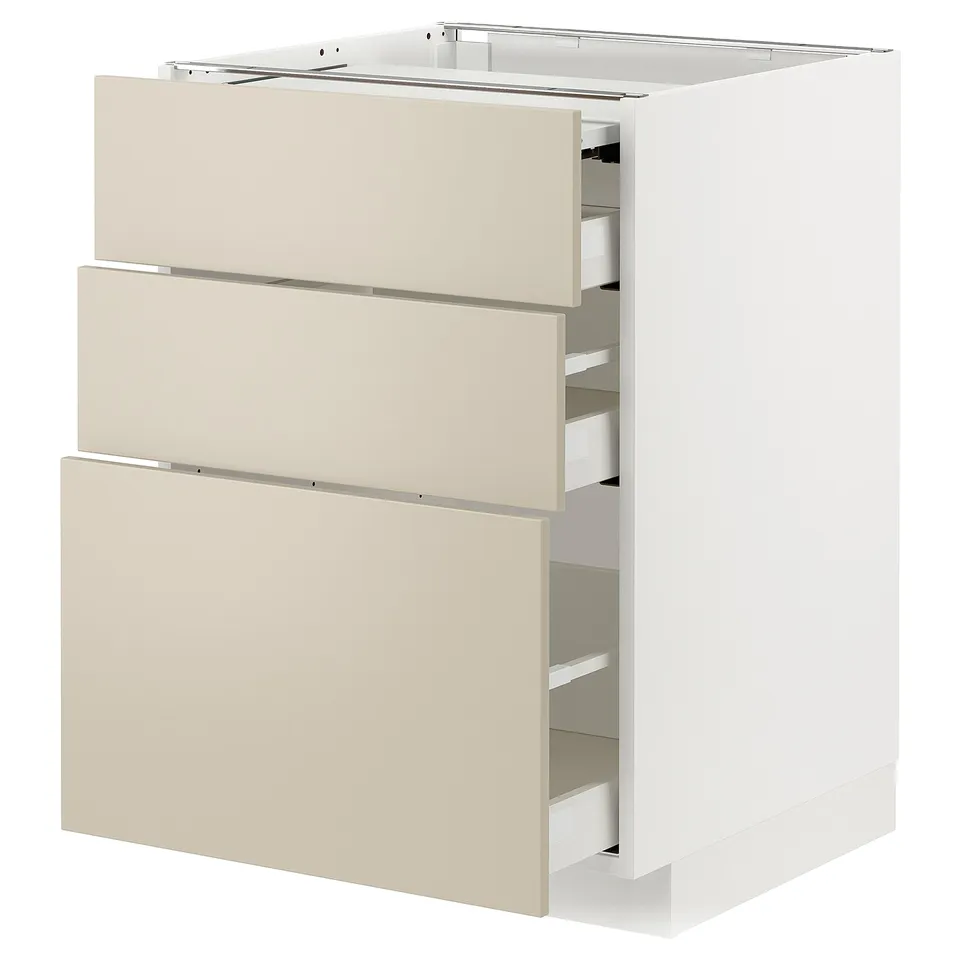 A white METOD kitchen cabinet with beige drawers, featuring a sleek, modern design.