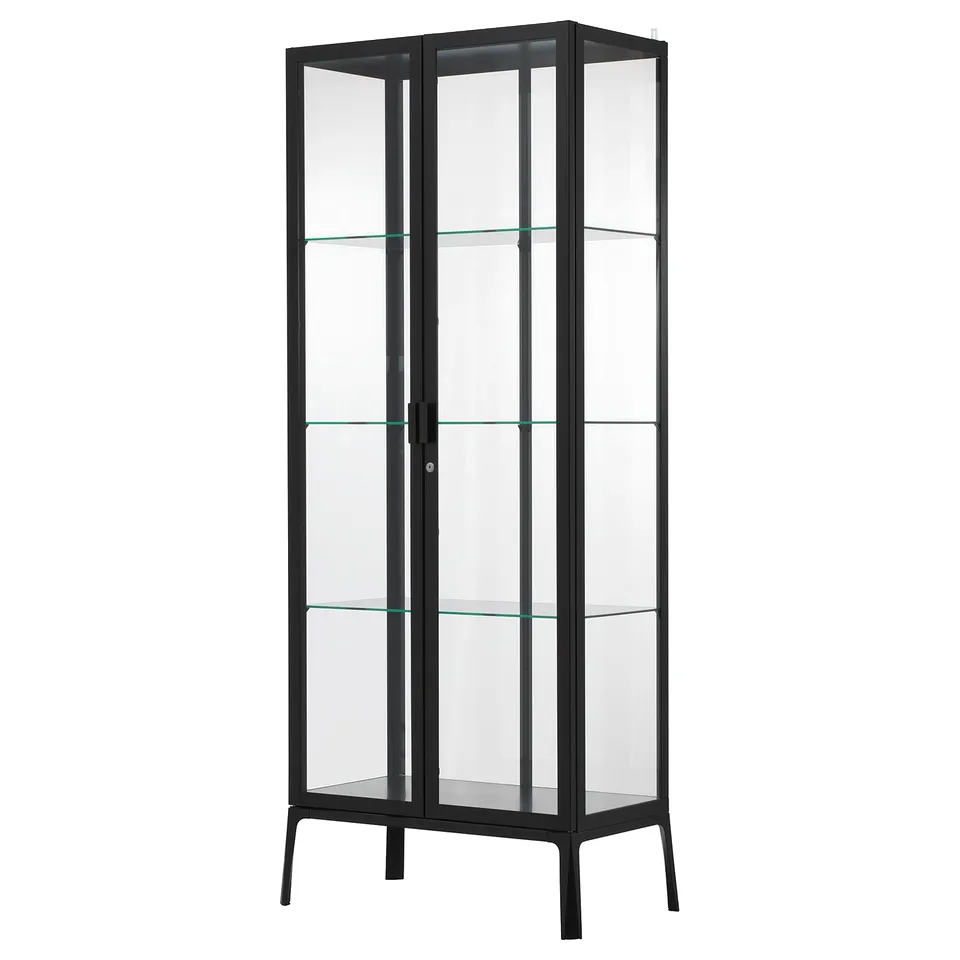 Elegant MILSBO black glass-door cabinet, displaying collectibles securely.