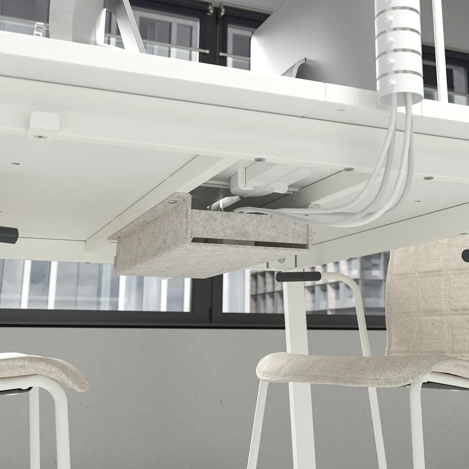 Modern office table with power supply, connected chairs.
