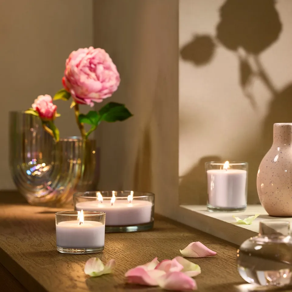 LOTSFÅGEL Scented candle in glass, Pink flowers pale pink, 40 hr