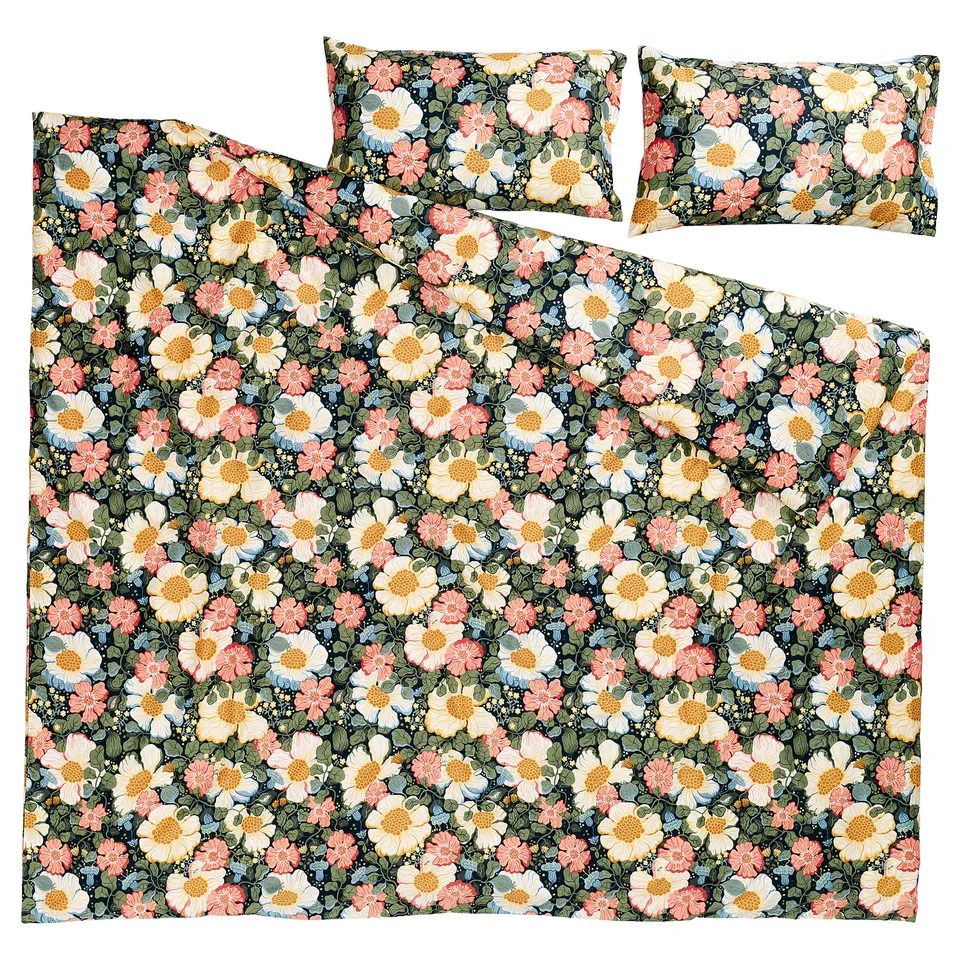 An ARENBOK bedding set in multi-colored floral print, made from recycled cotton and lyocell, with a duvet cover and two pillowcases.
