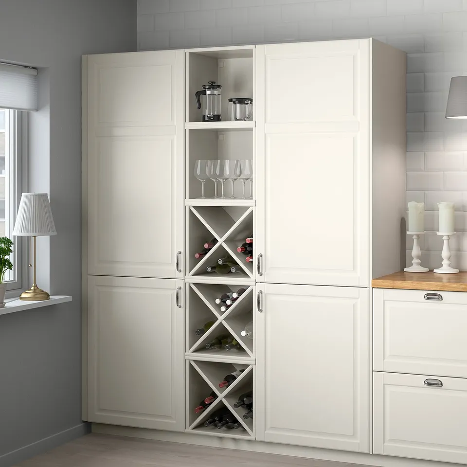 Grey kitchen cabinet with wine bottles and glasses.