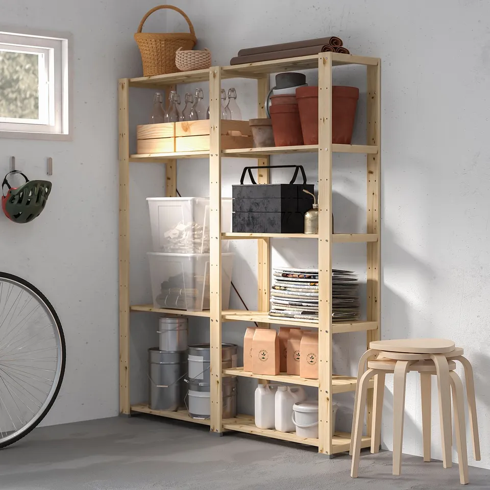 HEJNE wood storage unit in garage, holding various items; bike, helmets, tools, and containers; light wood colour, rectangular shape.
