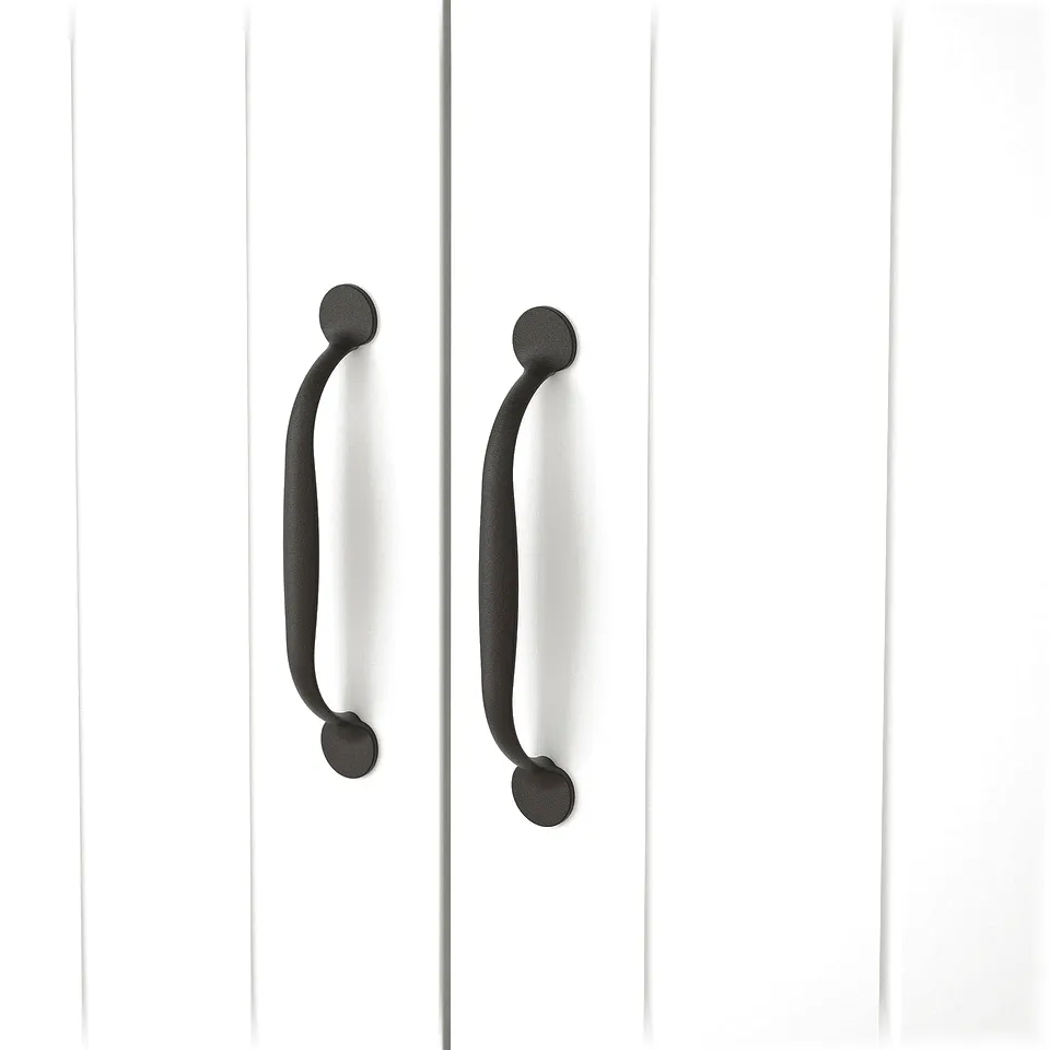 Two black metal handles on white wooden cabinets with grooved design.