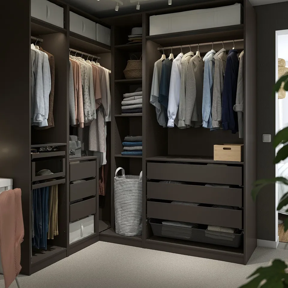 PAX corner wardrobe with shelves, drawers, hangers, mesh basket, and organiser trays, neatly storing clothes.