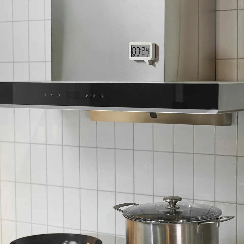 LJUNGPIPARE digital kitchen clock, magnetically stuck above range.