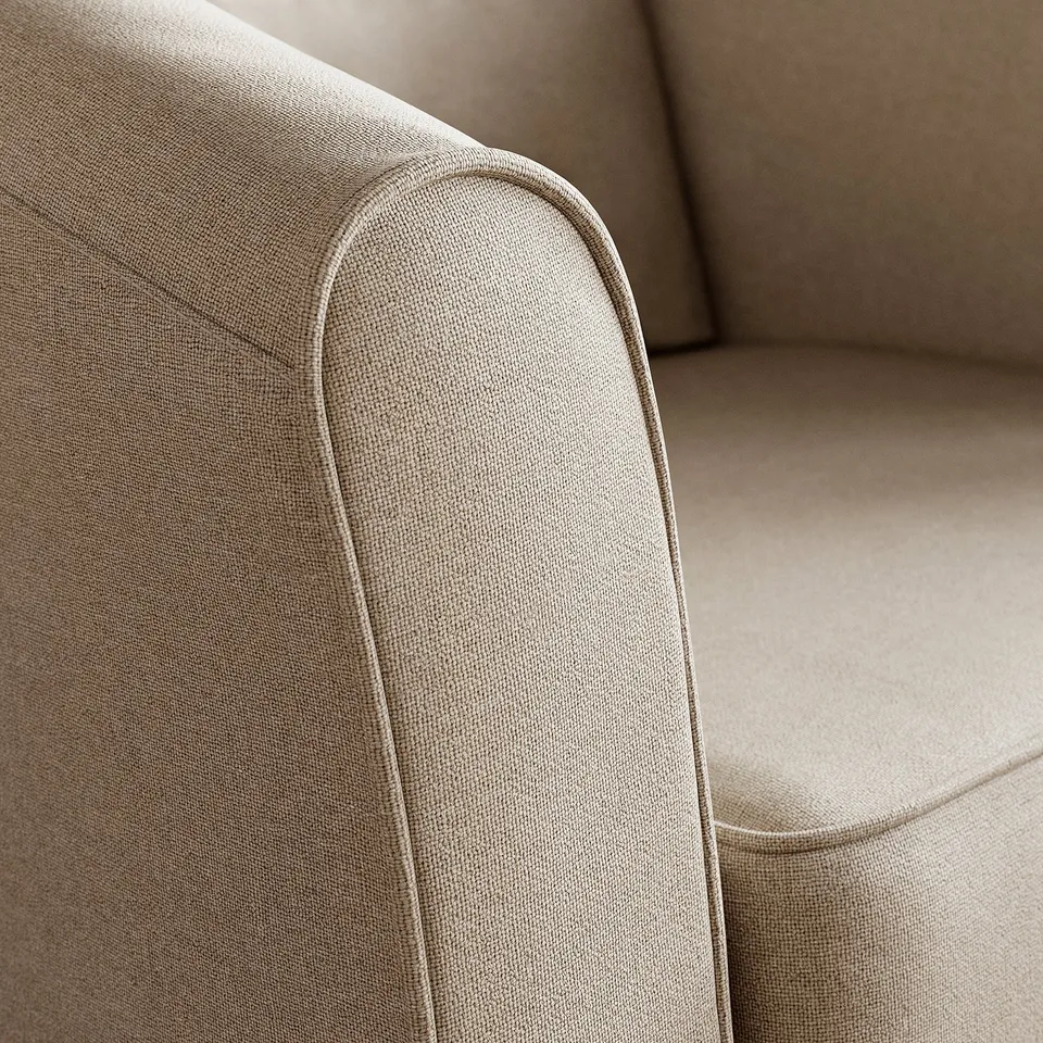 Close-up of beige fabric chair, smooth texture, detailed stitching, neutral decor background.