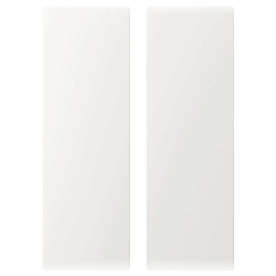 Two white rectangular flat surfaces, likely doors, with smooth edges and minimalist design.