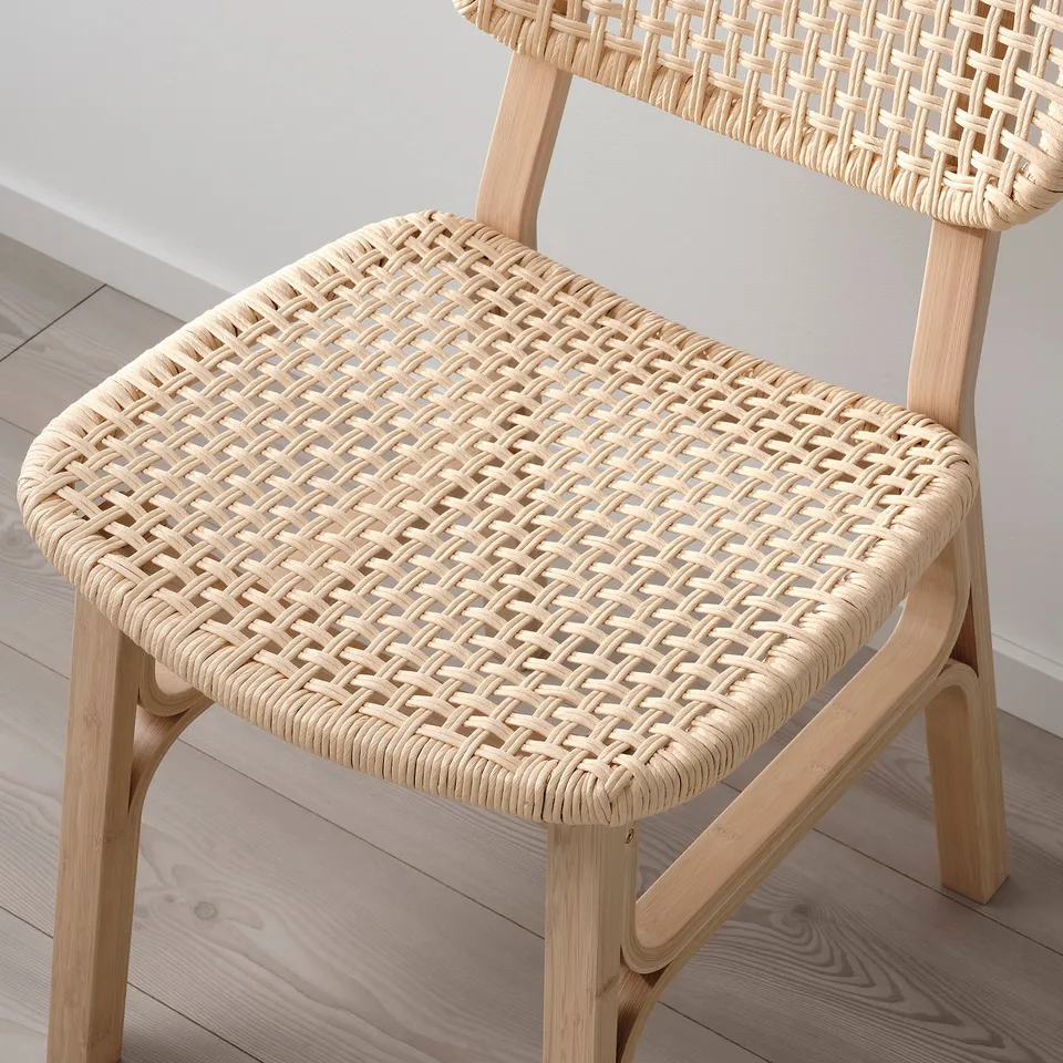 Woven bamboo chair, natural and breathable, showcasing intricate craftsmanship and durability.