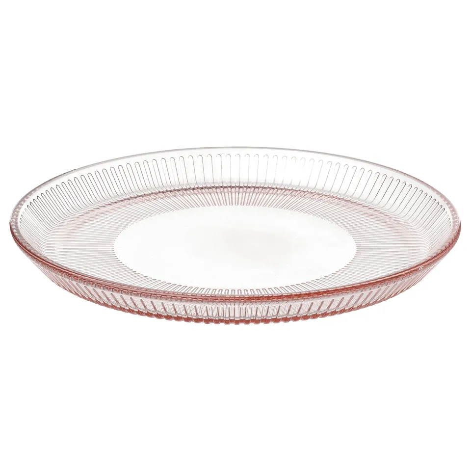 Pink tempered glass HAVSGÄDDA dinner plate with linear design.