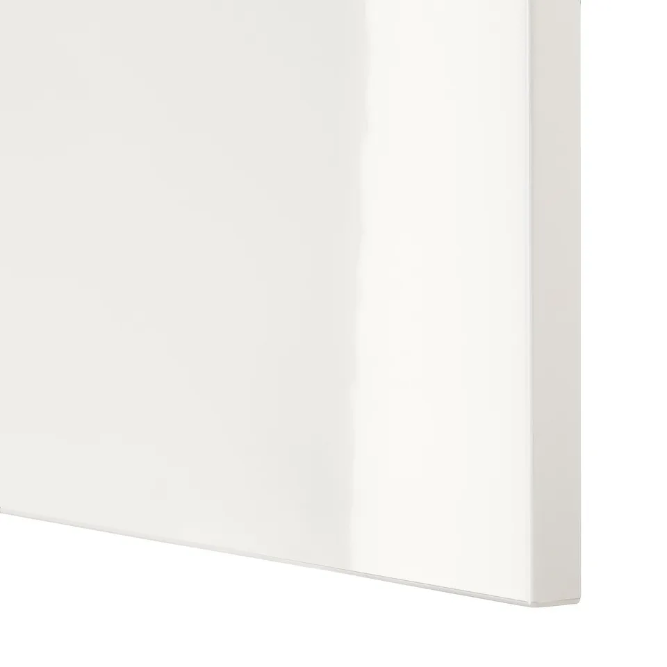 Close-up of white BESTÅ cabinet edge, sleek & modern design with smooth finish.