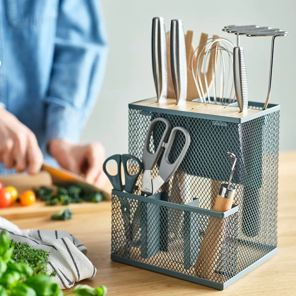 VIMPELFISK knife block holds knives and utensils, keeps them accessible and sharp, fits on kitchen counter.