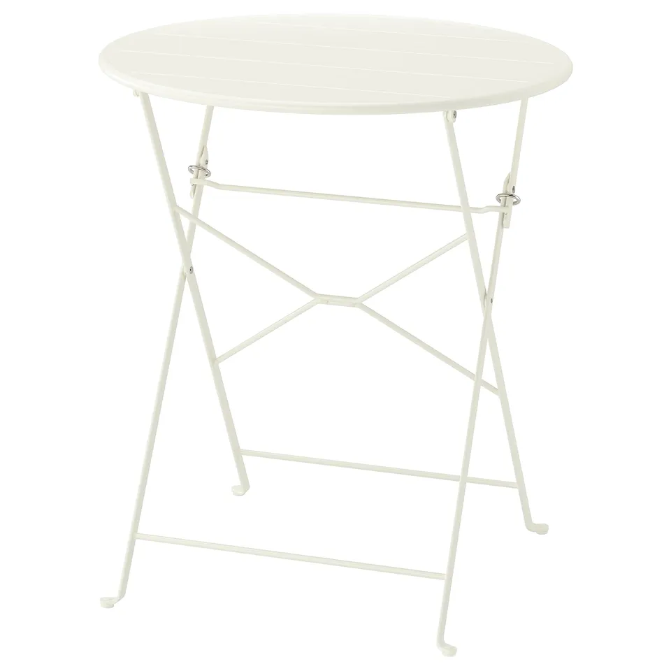 A white, round, foldable outdoor table with a metal frame and plastic feet, designed for small spaces.