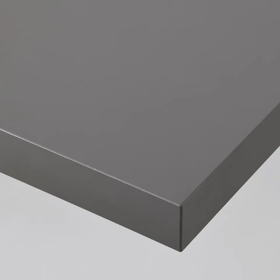 Grey table top with smooth, seamless finish and square edges, showing high-quality craftsmanship.