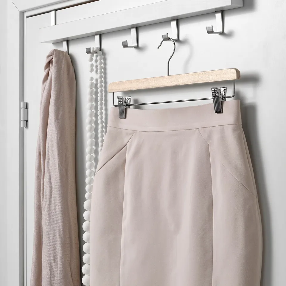Sleek hanger with clips holds skirt and scarf neatly; keeps clothes wrinkle-free.