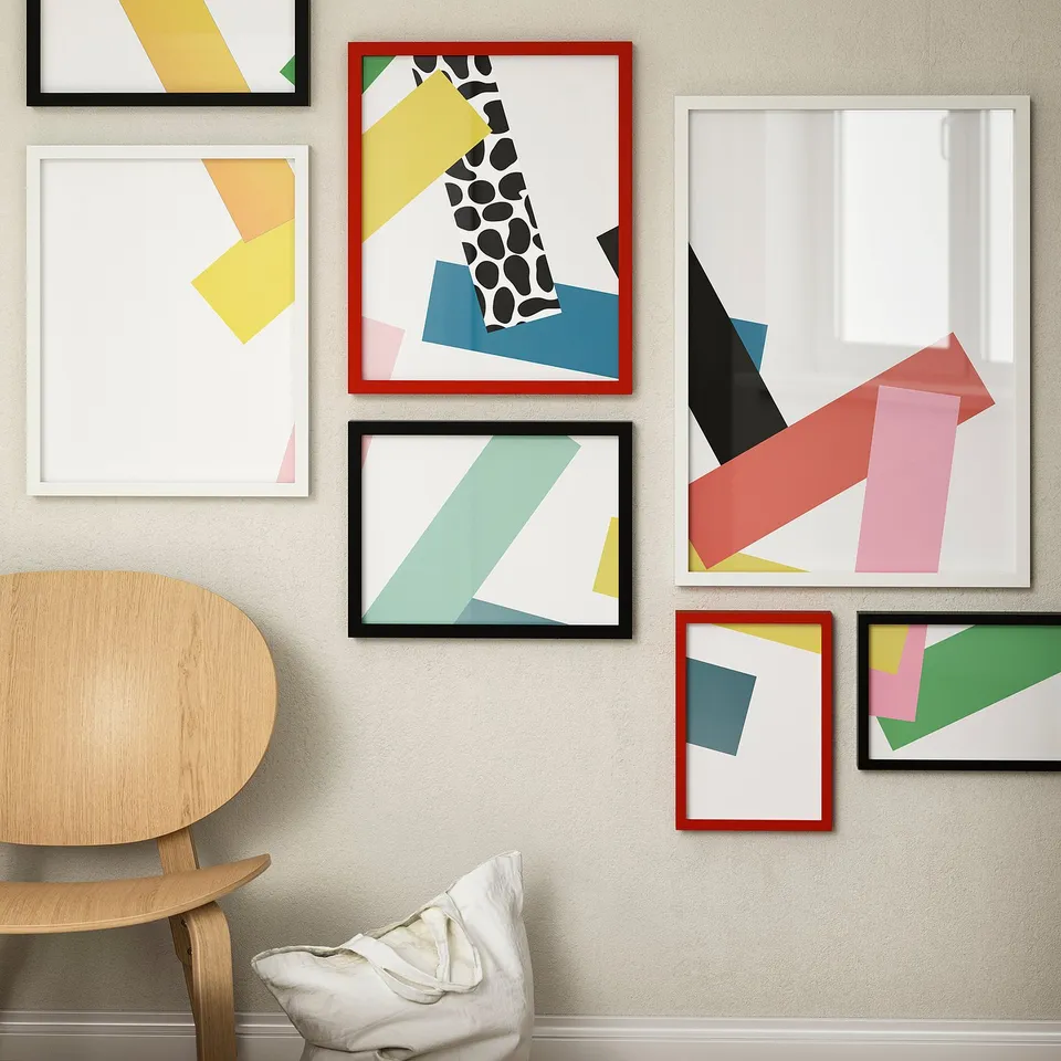 Modern wall art with RÖDALM frames, featuring geometric, abstract, and giraffe images in pastel and bold tones on a beige wall.