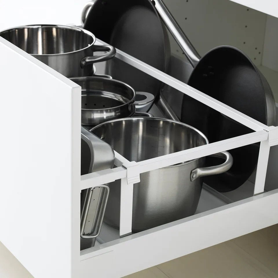Kitchen drawer with metal organisers. Holds pots and pans neatly in METOD storage.