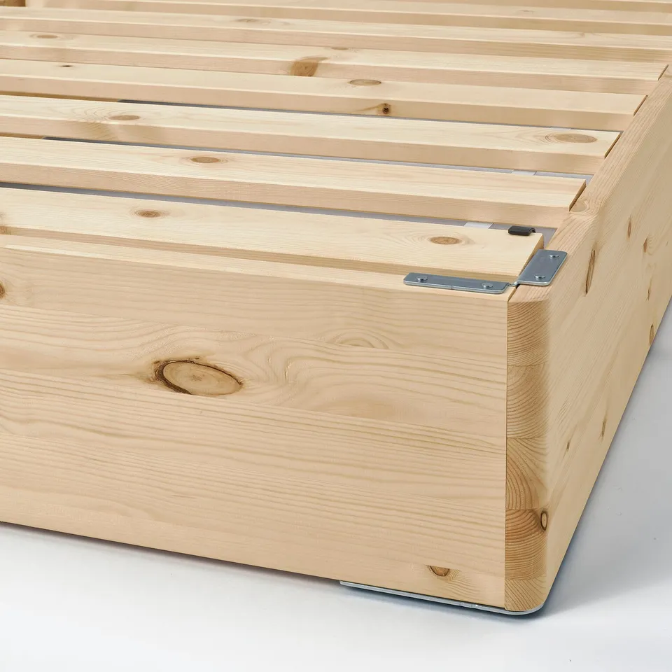 Mattress base made of solid pine, featuring metal connectors and a natural finish.