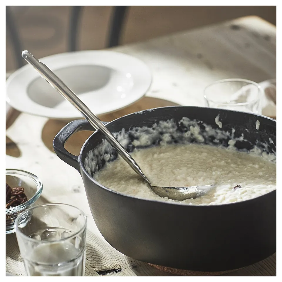 Ladle with soup and plates.