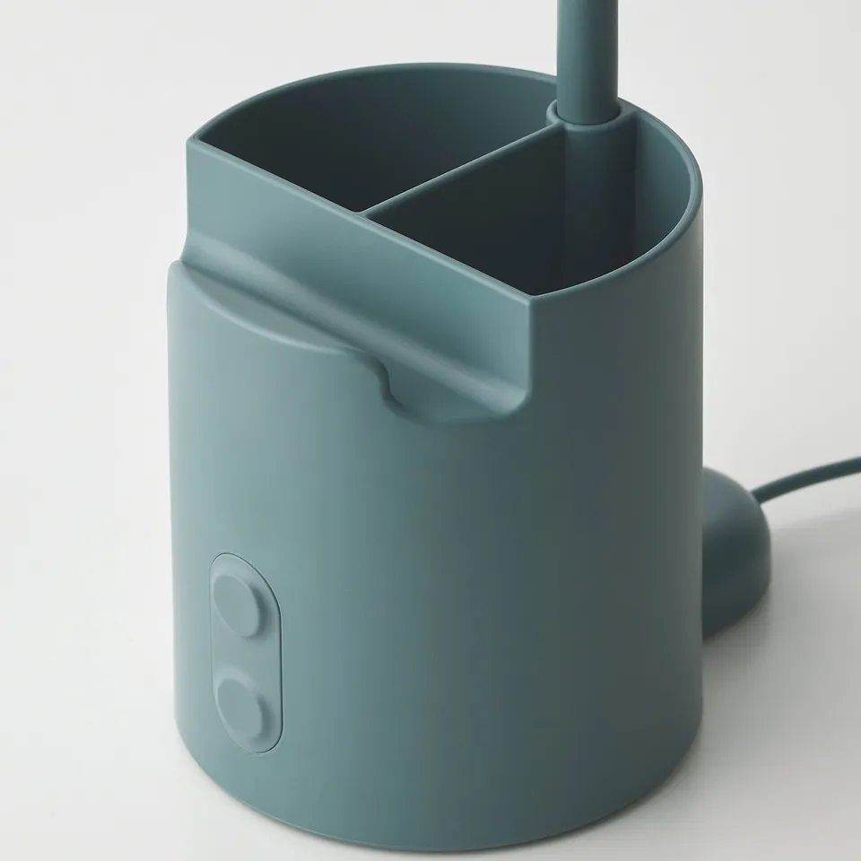 Blue desk lamp with pen holder, touch dimmer, and phone holder. Modern, functional design for organised workspace.