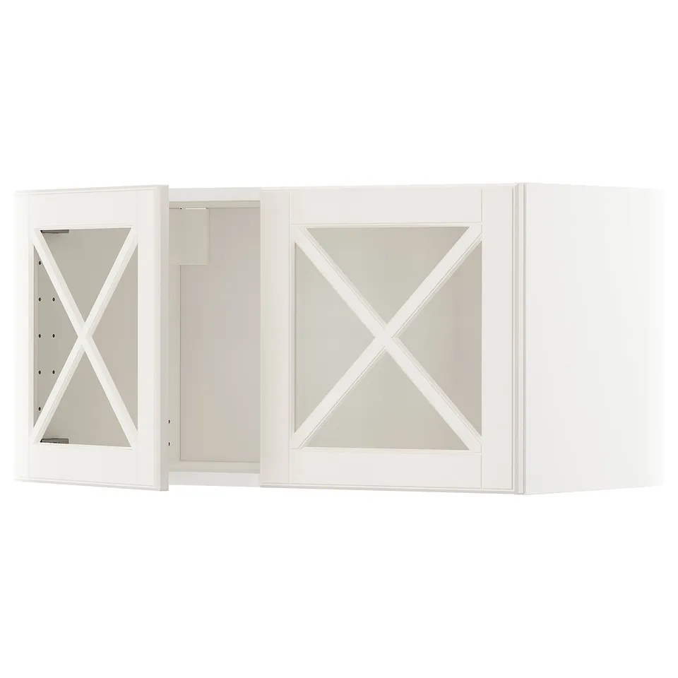 White wall-mounted kitchen cabinet set with bevelled glass doors and x-shaped frames.