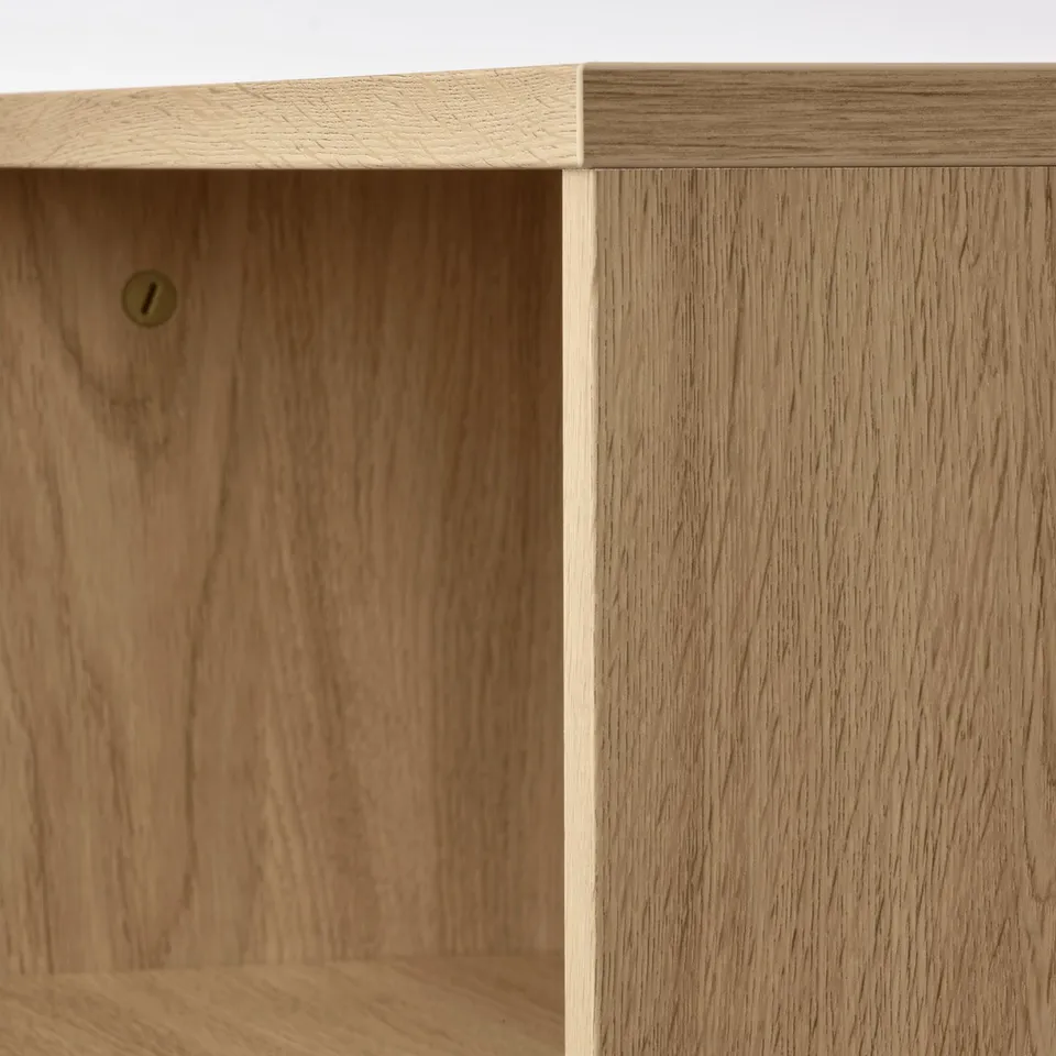 Close-up of HOLMERUD wood coffee tables sleek, natural finish and smooth edges. Shows craftsmanship and storage detail.