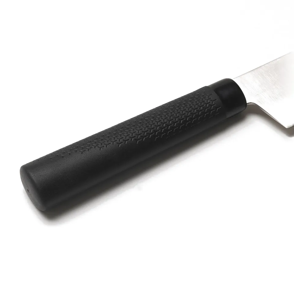 Close-up of a spatula with a black, textured handle and a shiny blade, suggesting high quality and durability.