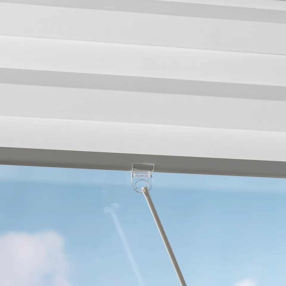 Close-up of TANDLUNDFLY dual roller blinds cordless lift mechanism, highlighting its soft-close functionality and light control.