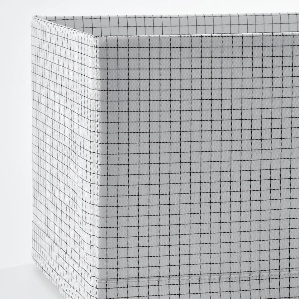 Foldable storage box with grid pattern, sturdy fabric, divider for organising items.