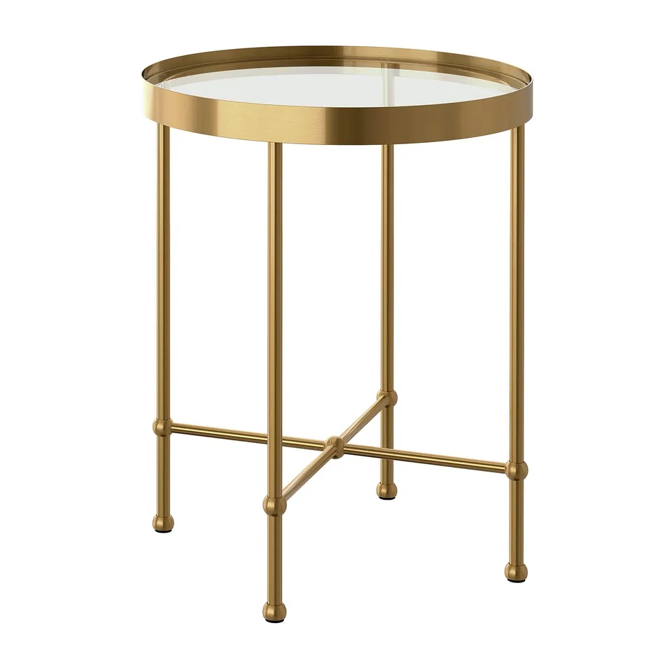 TORSJÖ side table: gold metal, round glass top, four-legged frame.