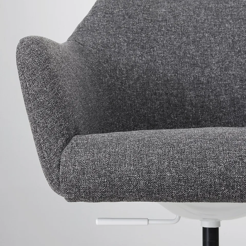 Close-up of grey upholstered office chair, showcasing soft padding and durable fabric.