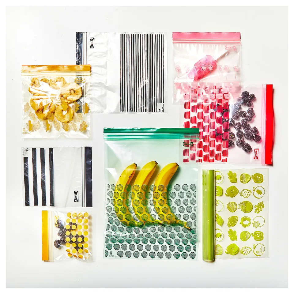 Bags of fruits & snacks on white surface