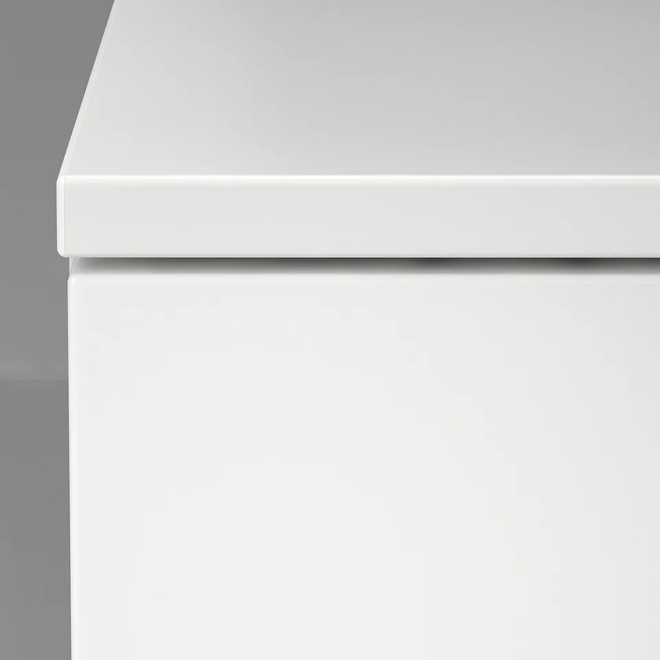 Smooth, white NORDLI drawer; clean lines, quality finish.