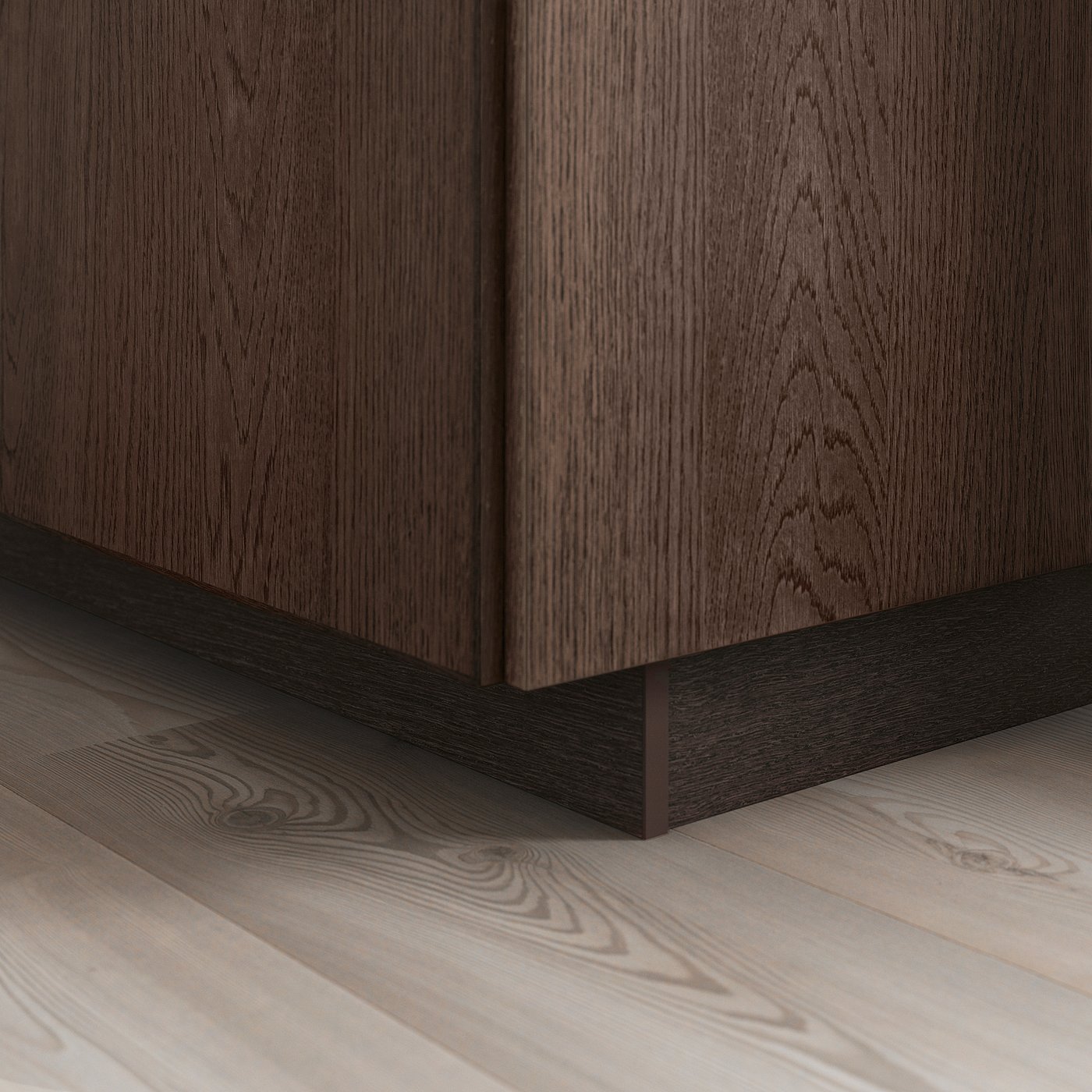 Dark wooden kitchen cabinet base with visible grain pattern and solid oak edging, showcasing a modern design detail.