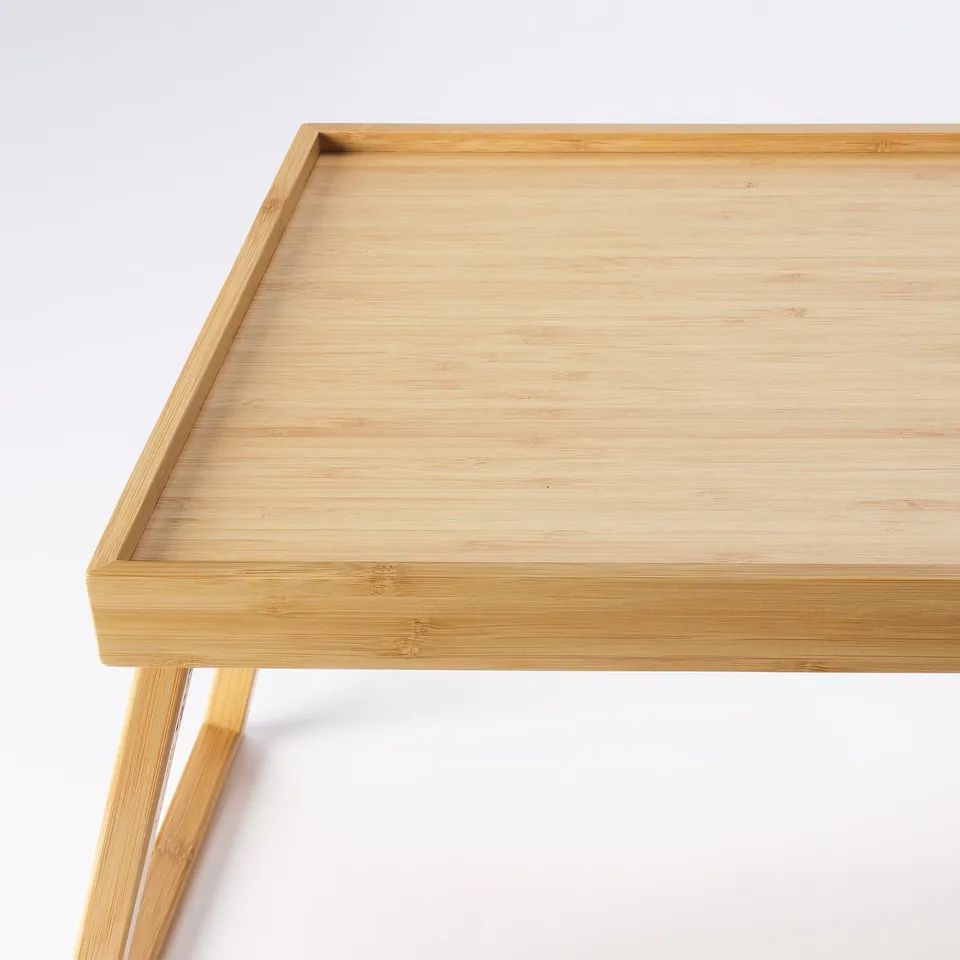 Elegant bamboo bed tray with foldable legs, smooth surface, high quality.
